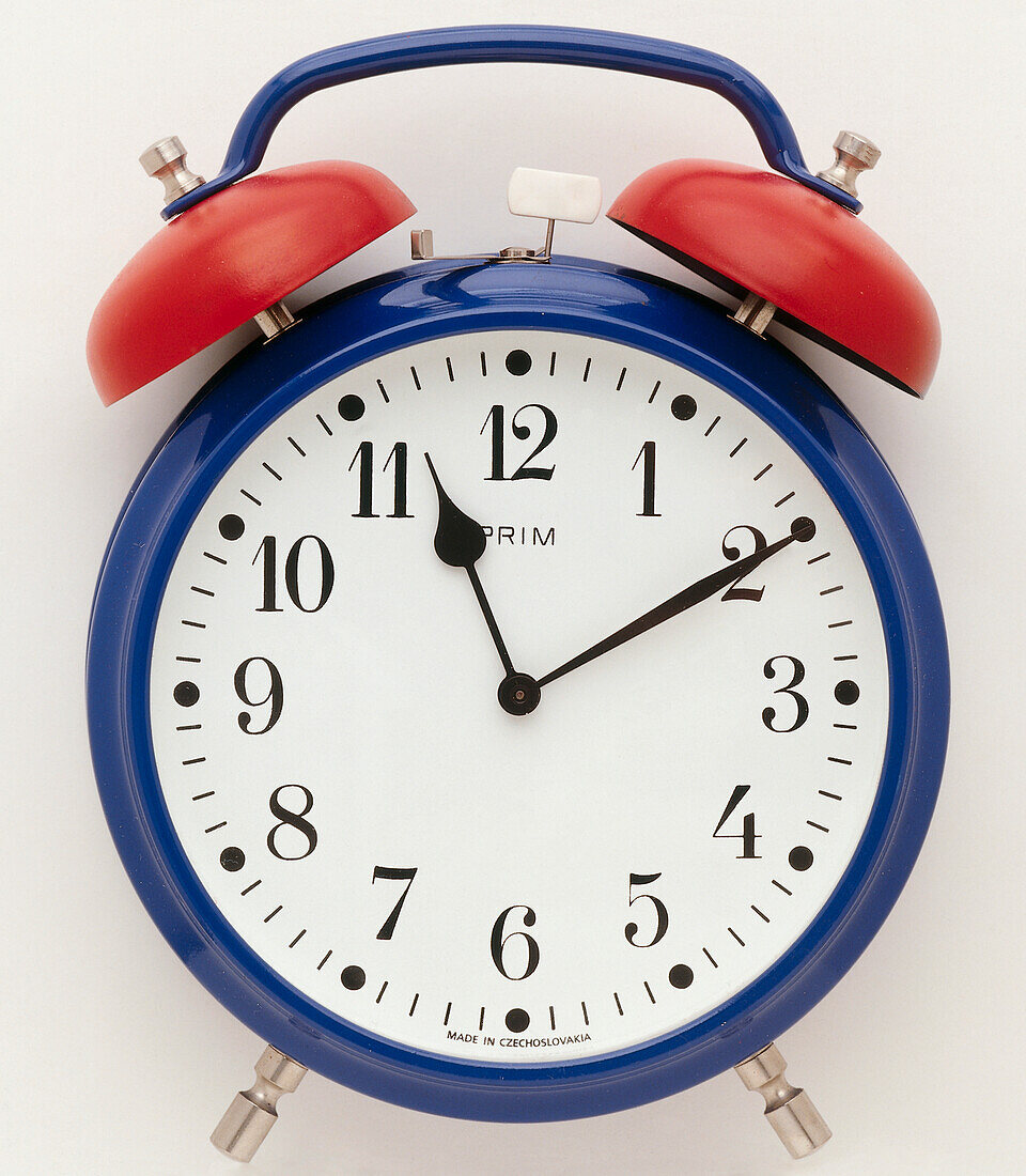 Traditional blue alarm clock with red bells