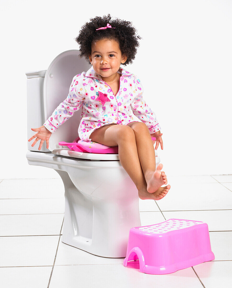Toddler girl on toilet