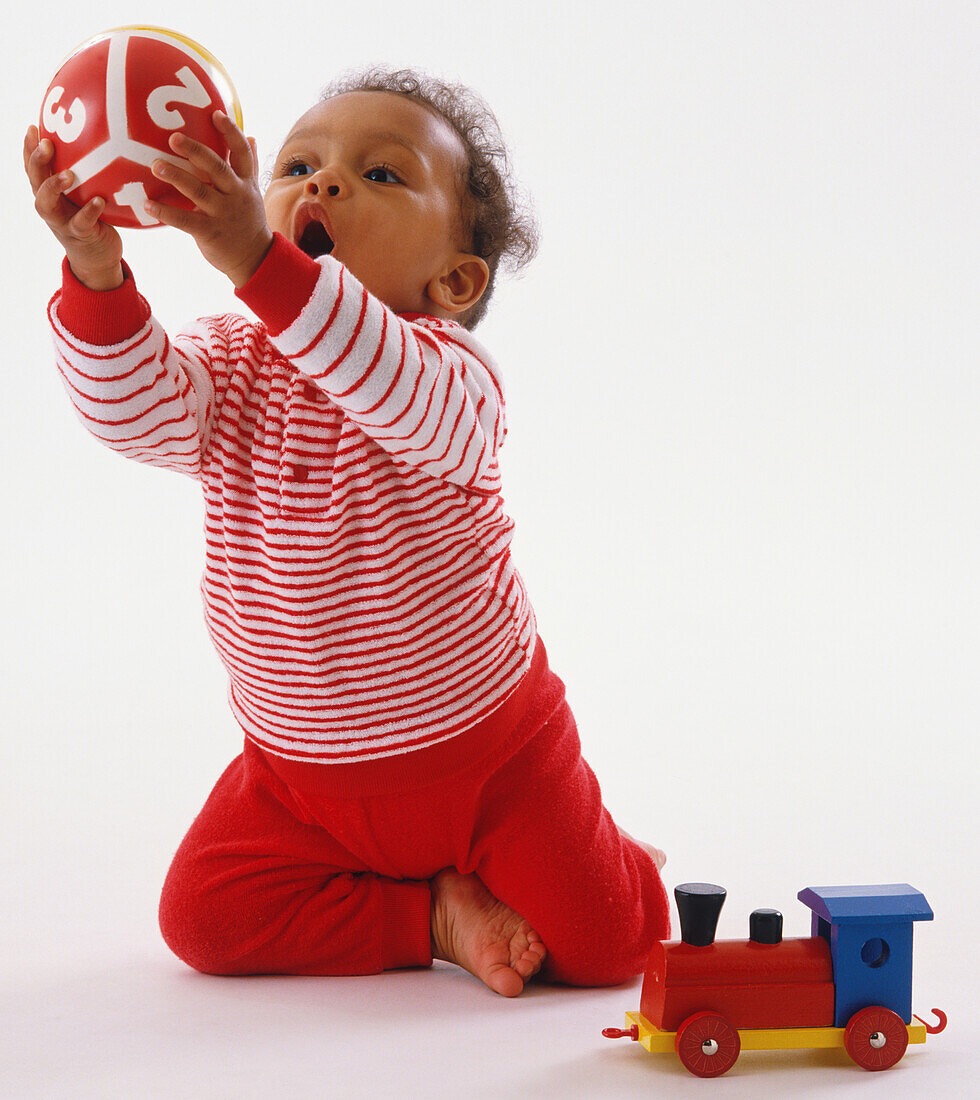 Toddler grasping ball