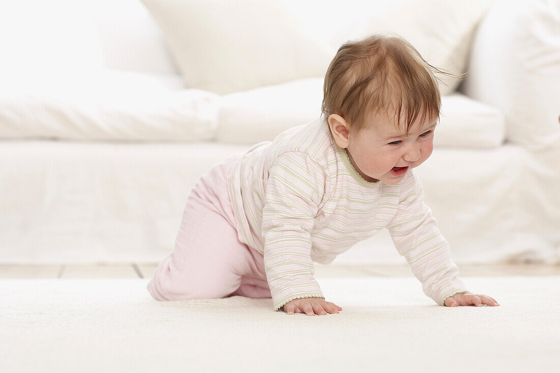Baby girl crawling on all fours