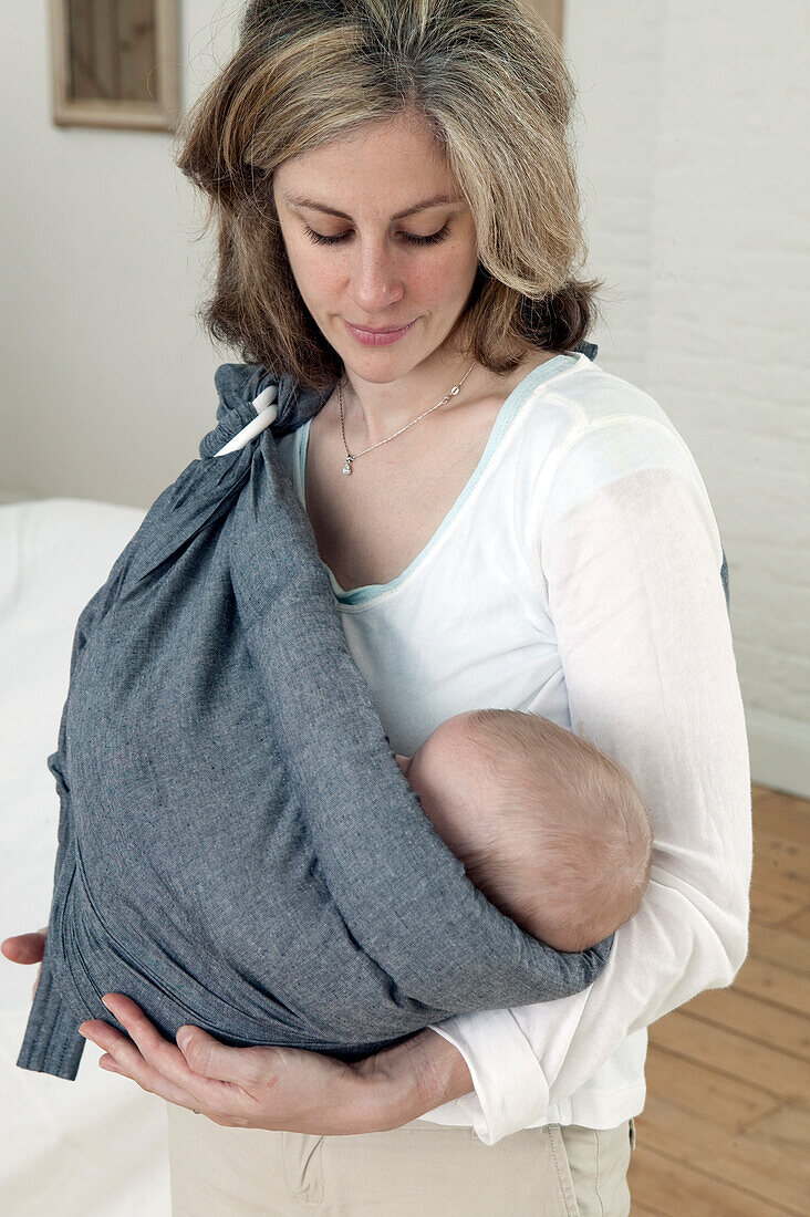 Woman with baby in sling