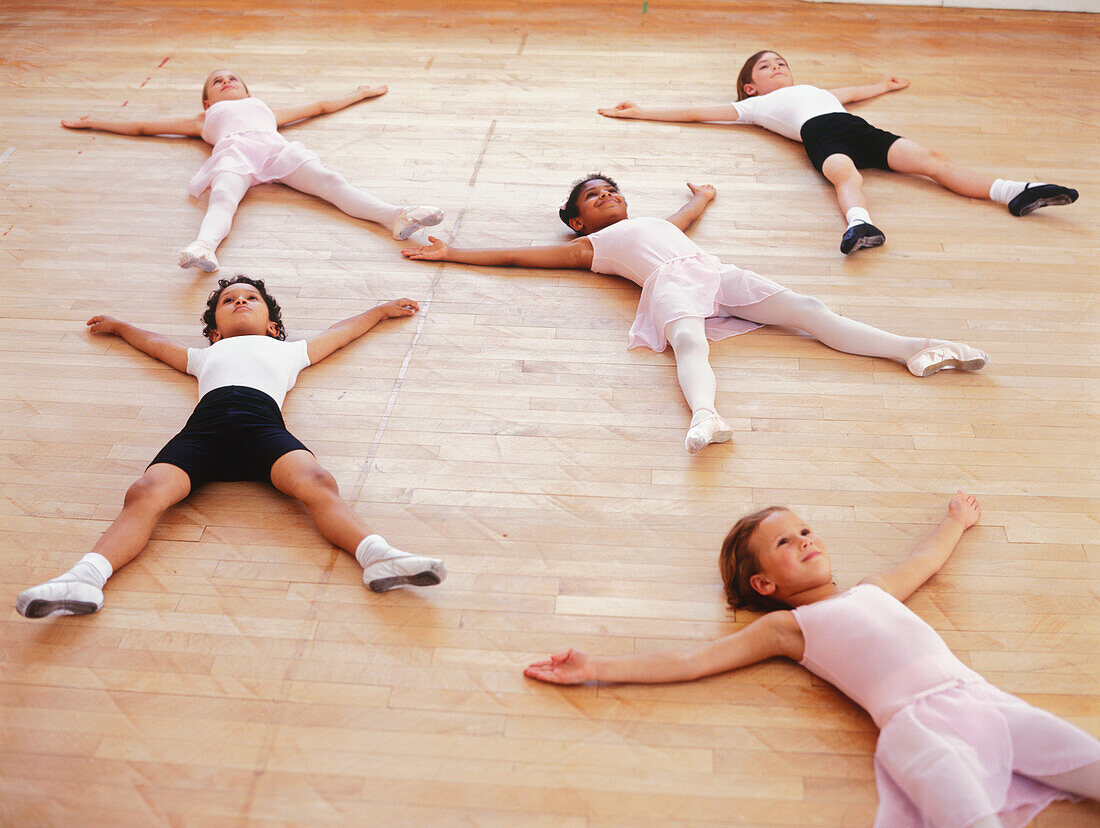 Ballet dancers lying on studio floor