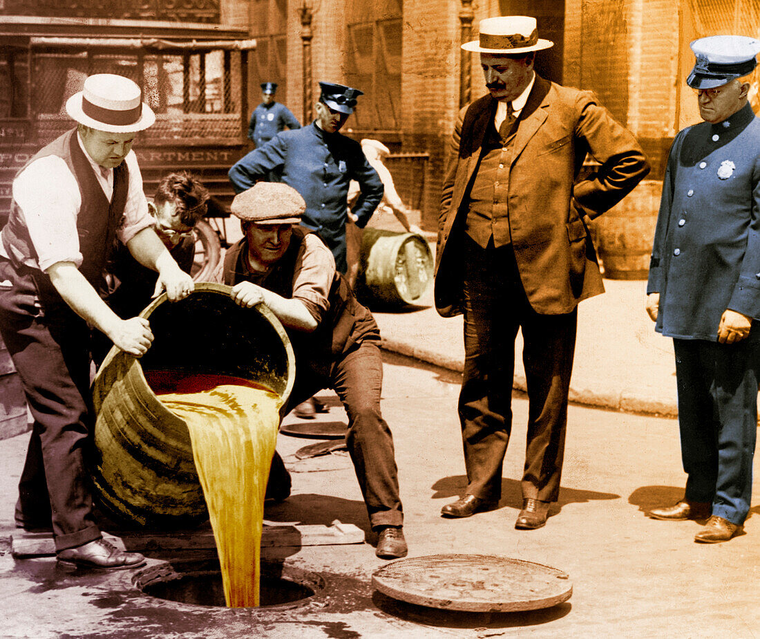 Prohibition agents dump liquor into sewer, NYC