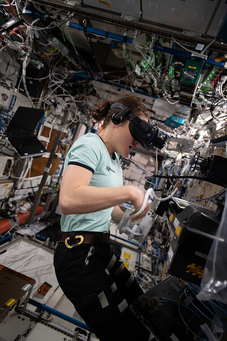 NASA wearing a virtual reality headset on the ISS