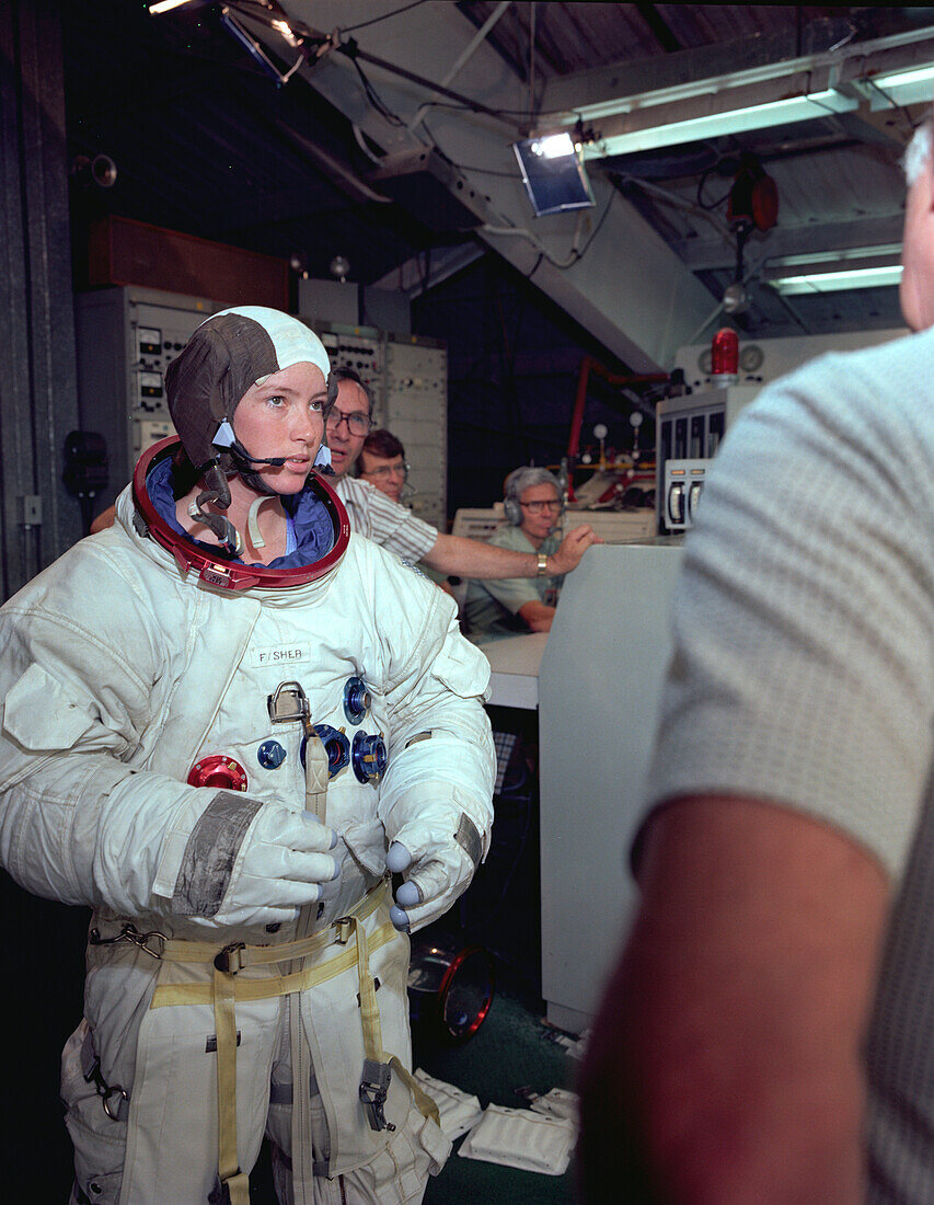 Astronaut Anna Fisher suiting up for training