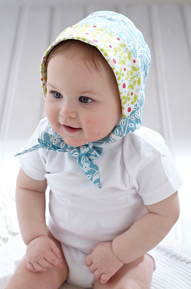 Baby girl wearing bonnet