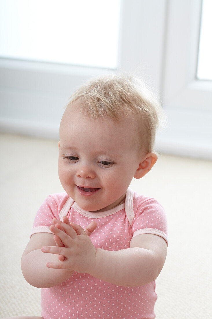Baby girl clapping her hands