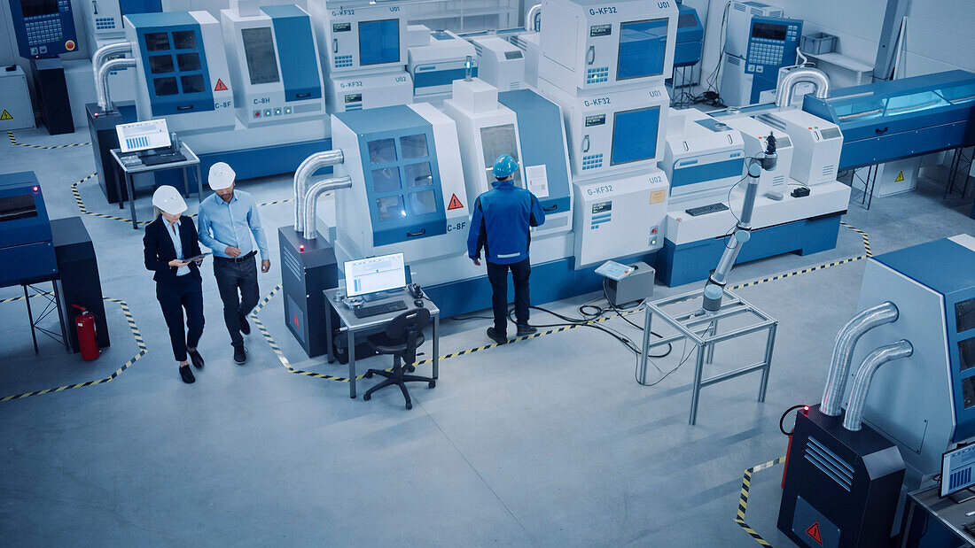 Manager and engineer inspecting a facility