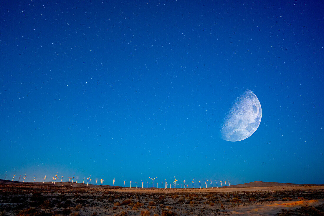 Moon over windmills in the desert