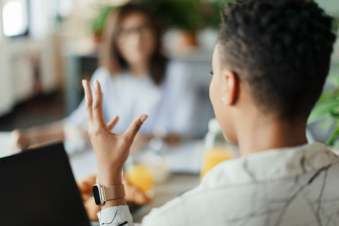 Businesswoman talking and gesturing in meeting