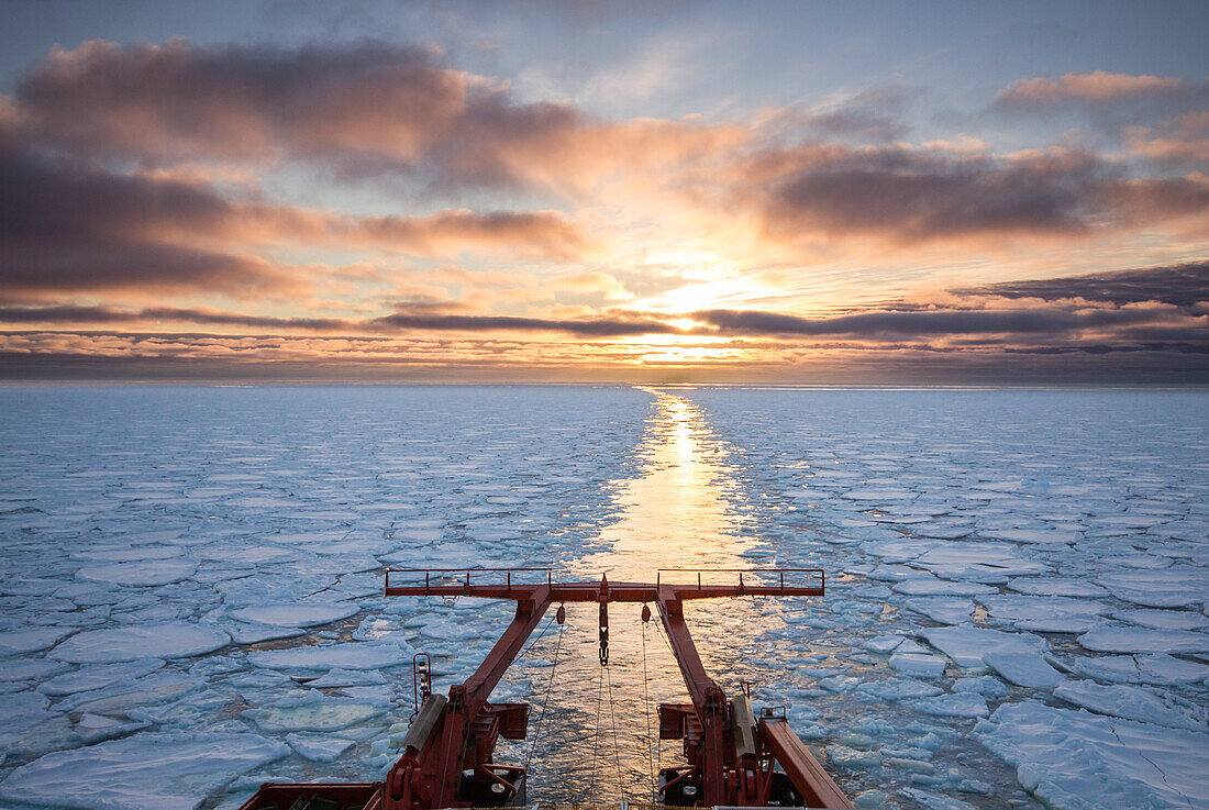 Sunset from the aft of a research vessel cruising in ice