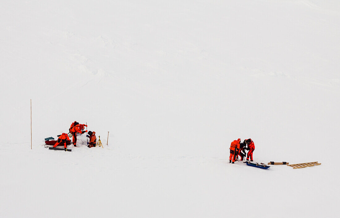 Polar scientists working on an ice floe, Antarctica