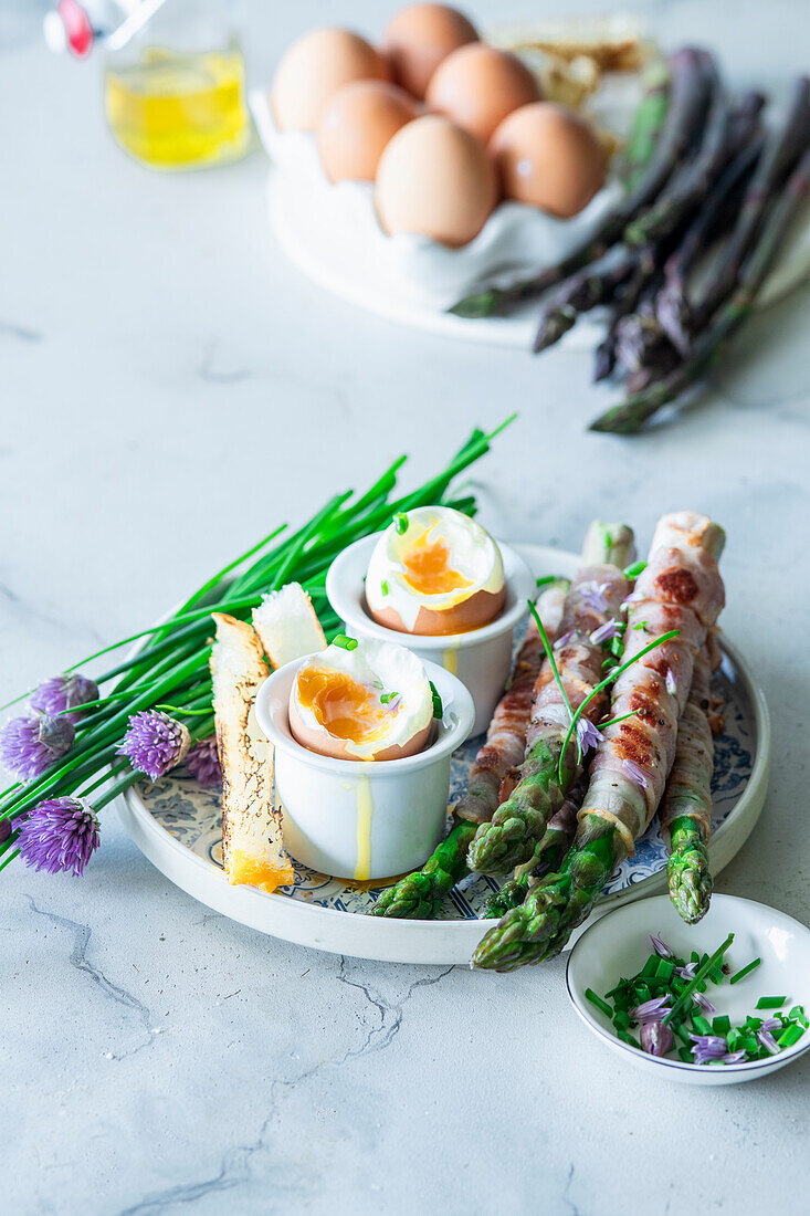 Asparagus fried in bacon with soft bolied egg