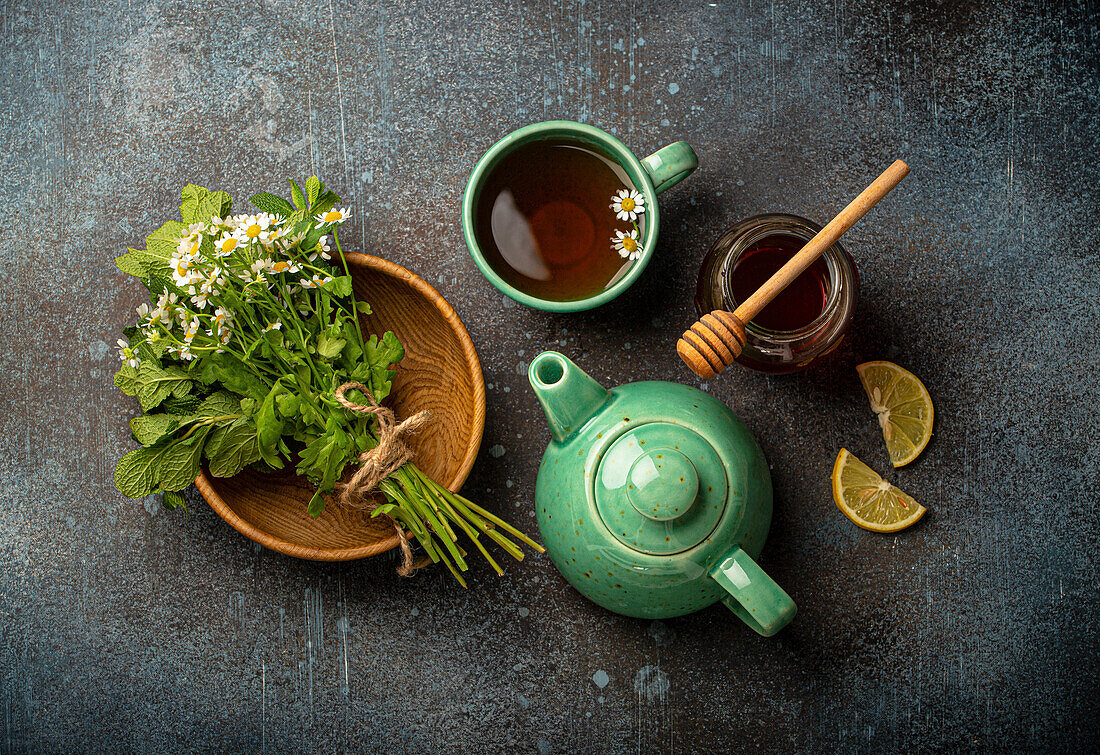 Herbal tea with camomile, fresh medical herbs and flowers