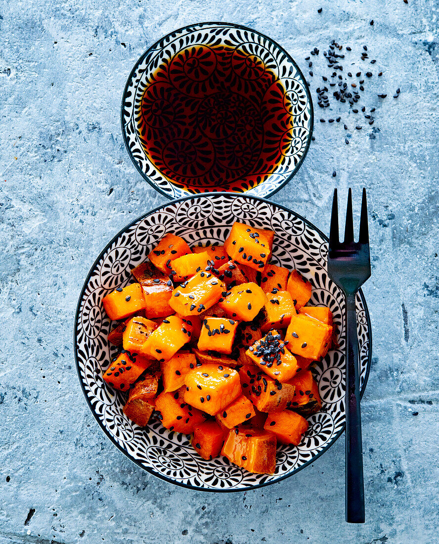 Pan-fried sweet potatoes with black sesame seeds and soy sauce