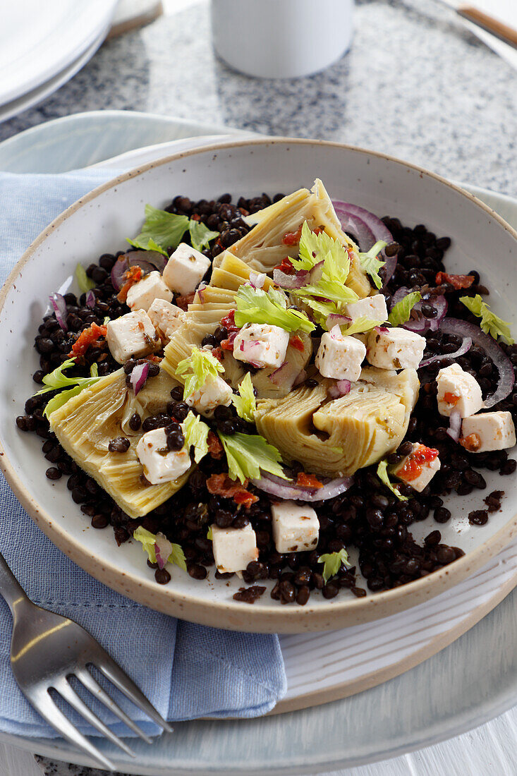 Black lentils with artichokes and feta cheese