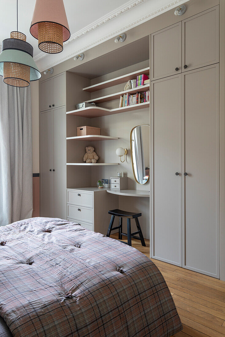 Bedroom with built-in wardrobe, dressing table and pendant lights