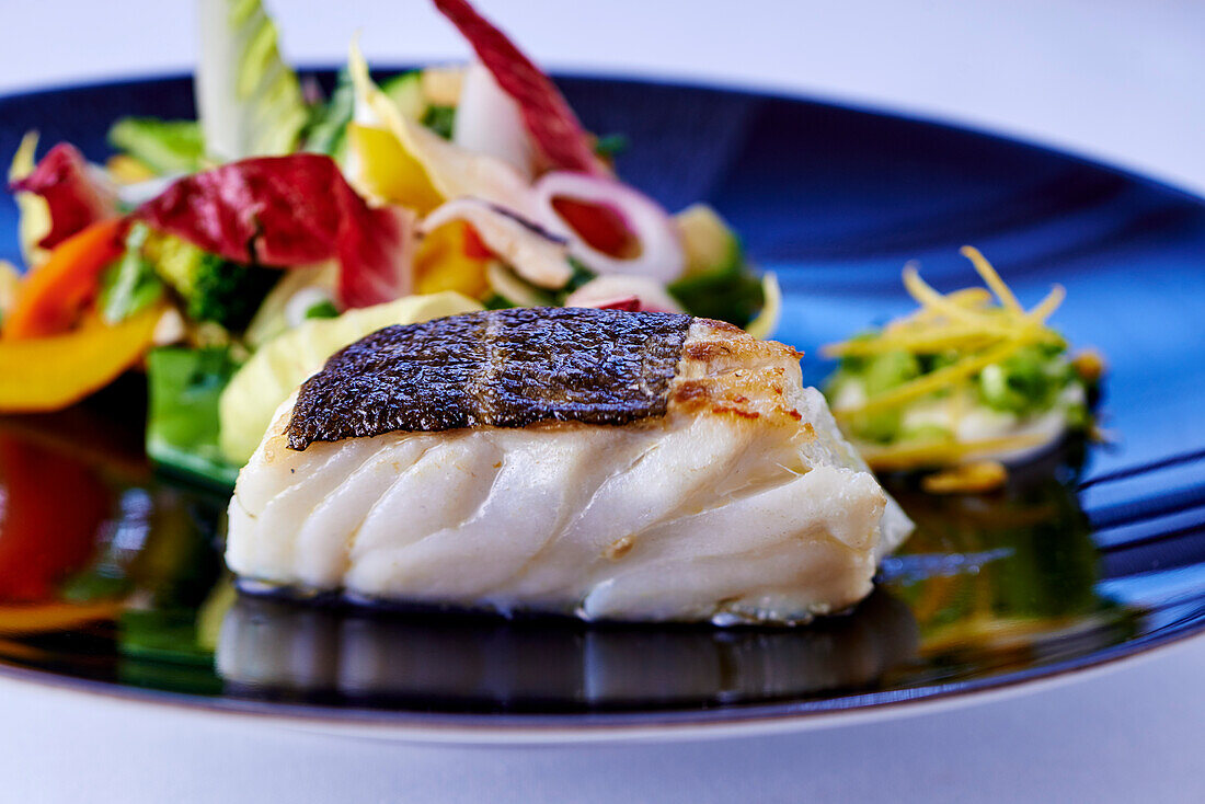 Cod fillet with salad