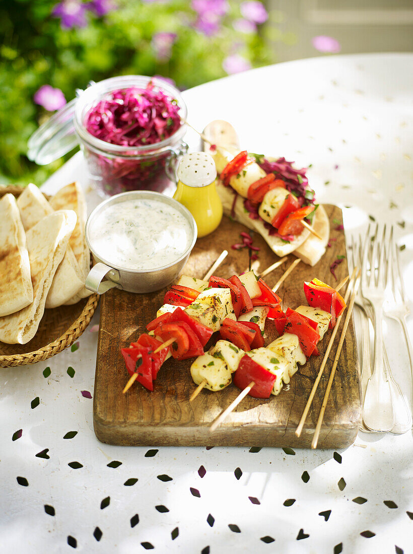 Lemony hake bell pepper kebabs with red cabbage and Tzatzika