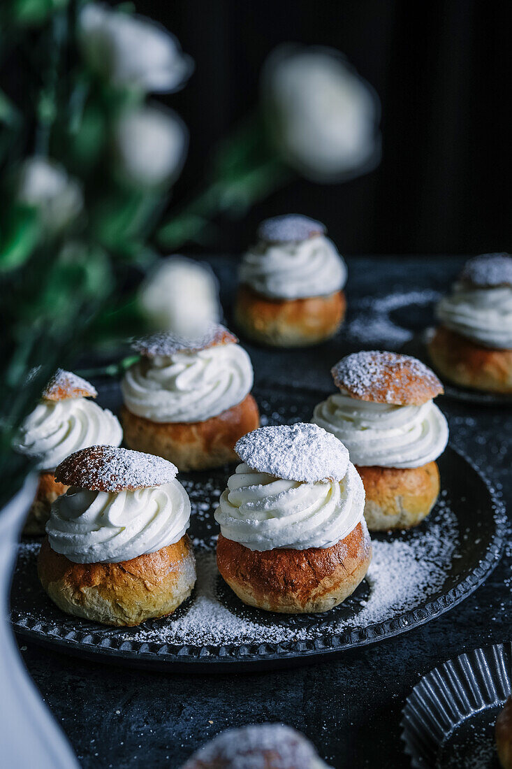 Semla (Swedish cream puffs) with icing sugar