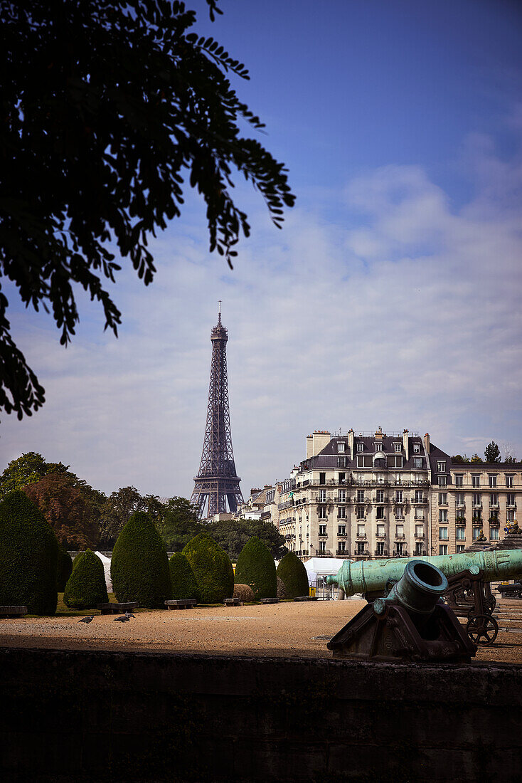 Artillery cannon at Les Invalides with the Eiffel Tower in the background, Paris, France