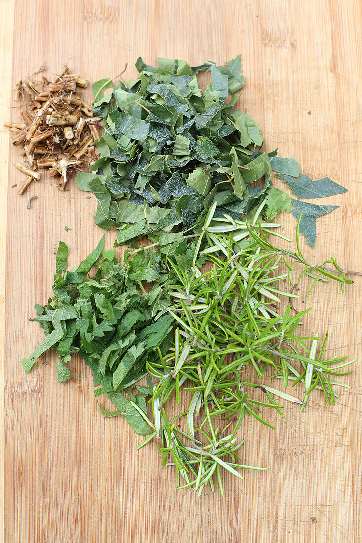 Finely chop herb leaves (for hair tonic)