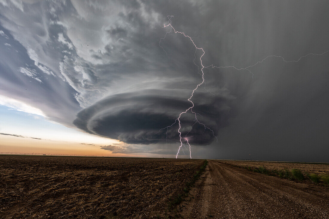 Supercell thunderstorm with lightning strike, Kansas, USA