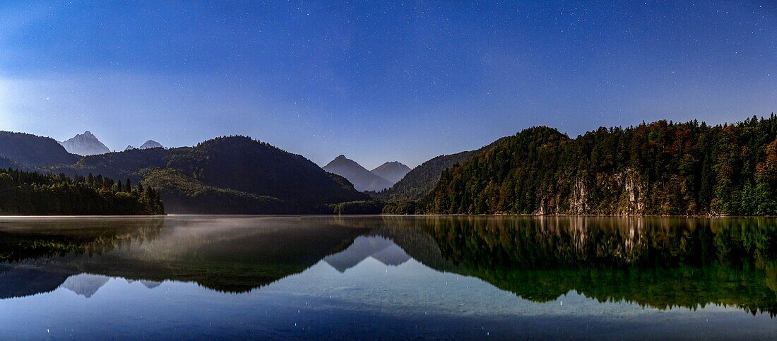 Panoramic View of Night Sky over Lake Alpsee, Germany