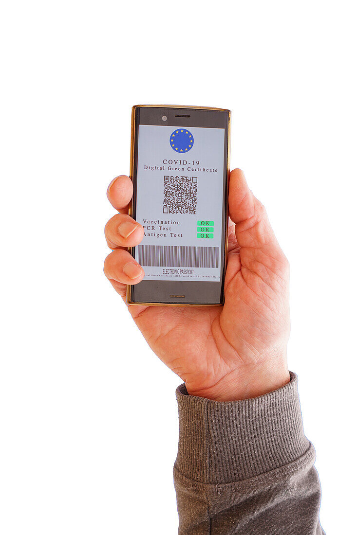 Man holding a phone with green Covid-19 digital certificate