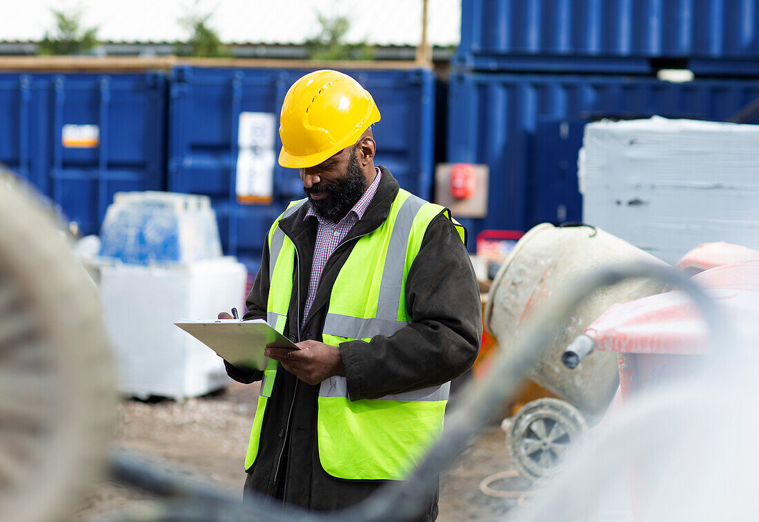 Foreman with clipboard at construction site