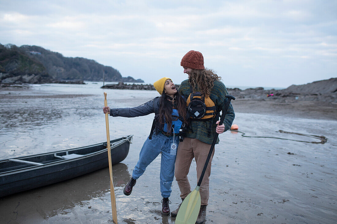 Carefree couple canoeing, Kent, UK