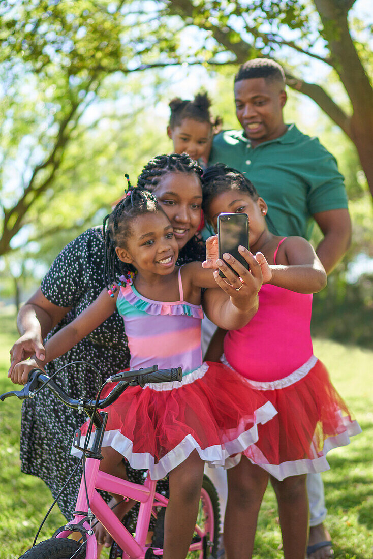Family taking selfie in park