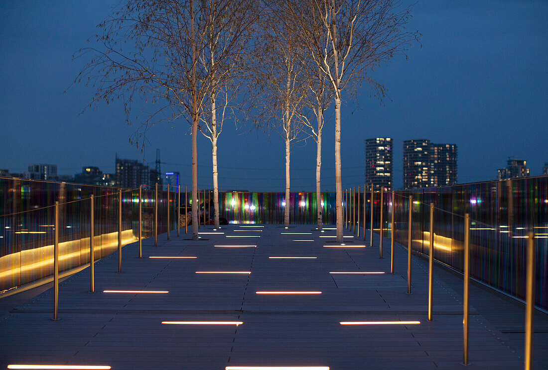 Modern illuminated city park, London, UK