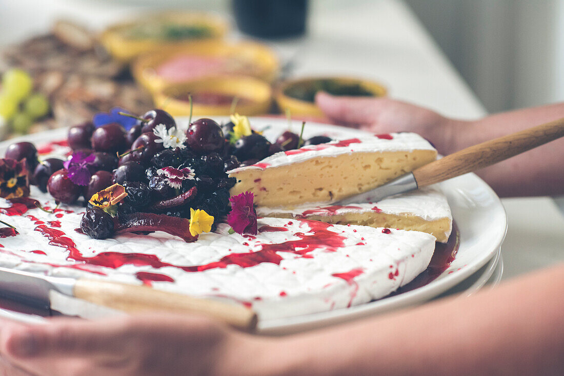 Cheese board with berry sauce