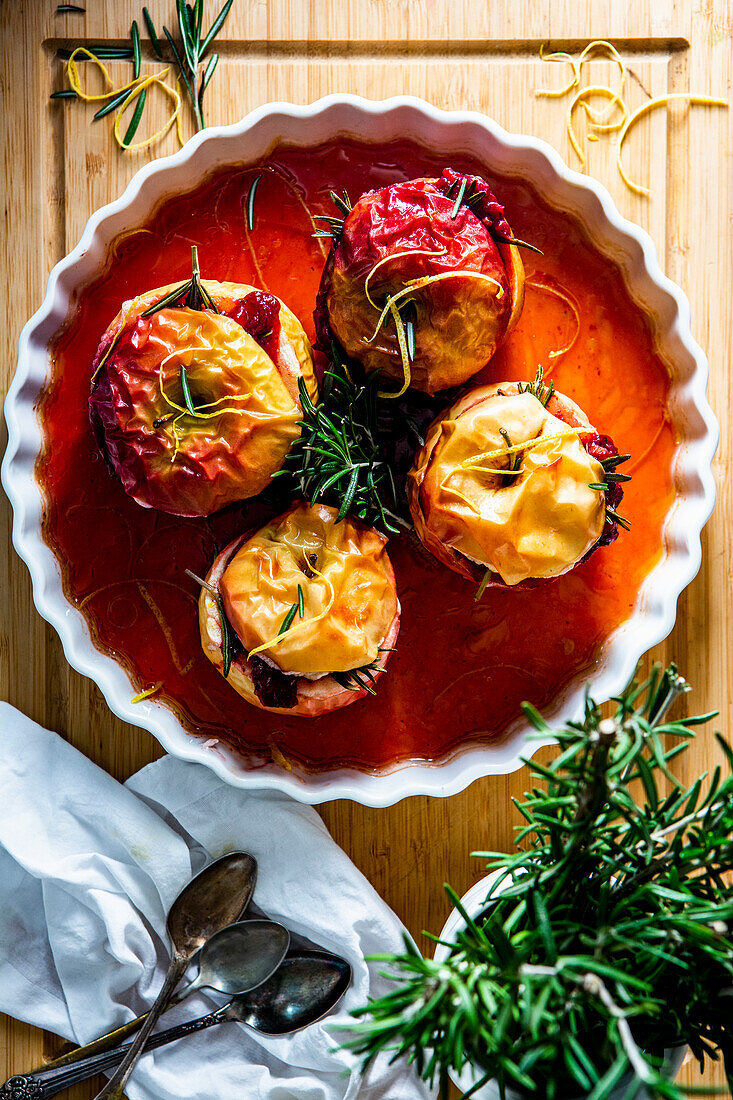 Baked apples in rosehip sauce