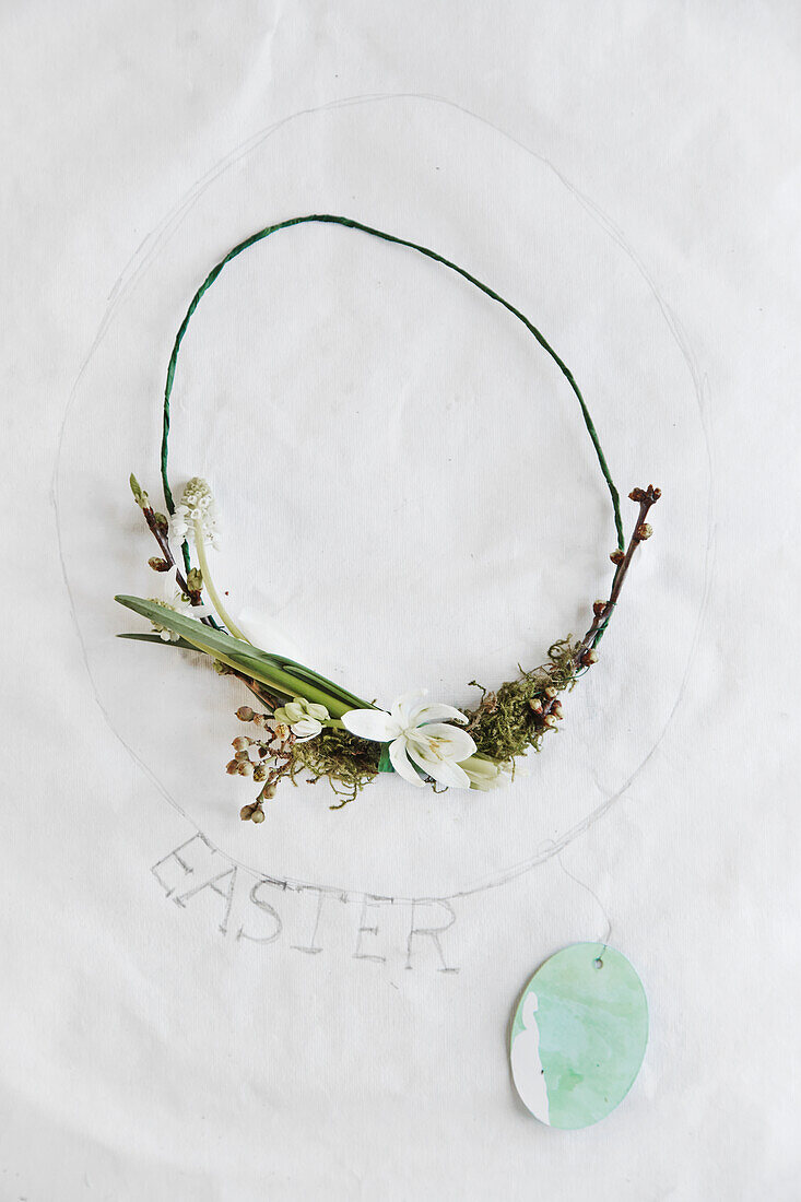 Easter wreath with a snowdrop on a white background