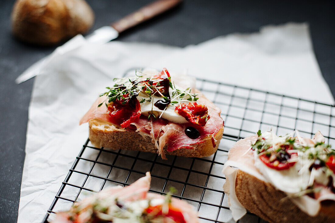 Baguette with prosciutto, mozzarella, tomatoes, cress and balsamic vinegar