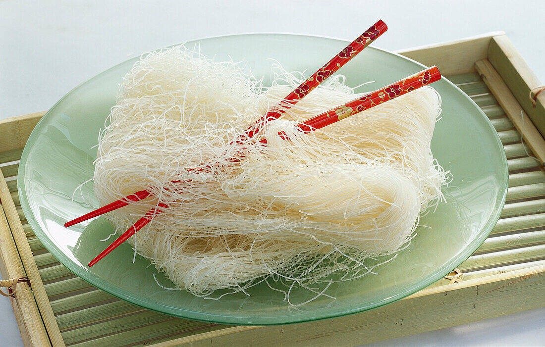 Plate with fine rice noodles and chopsticks