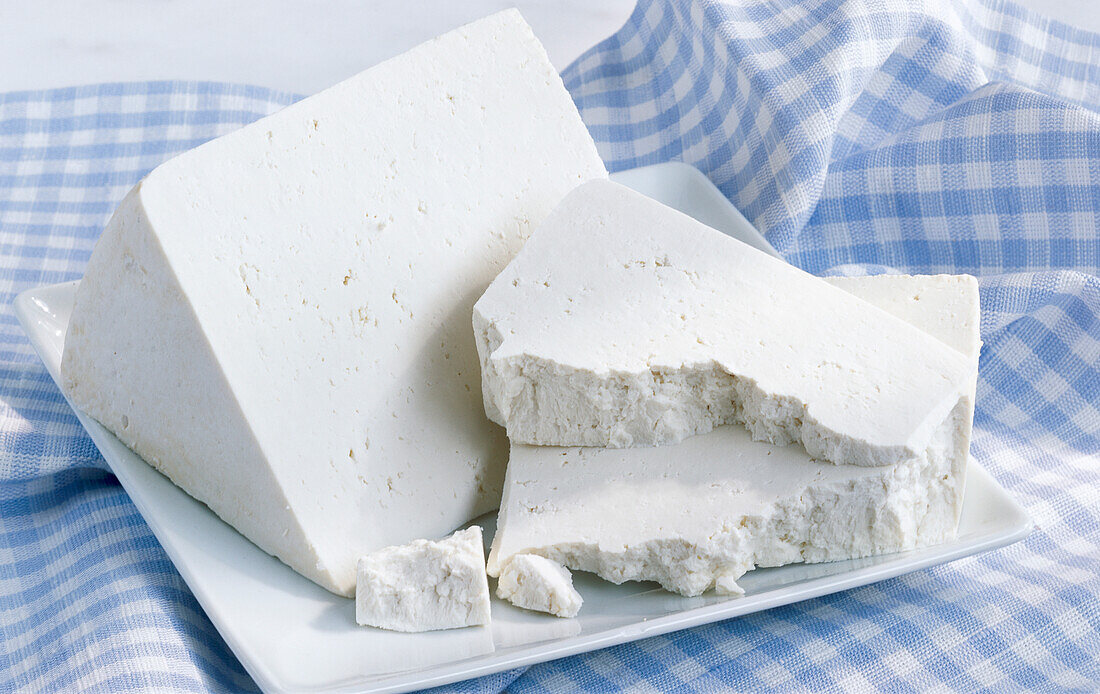 Pieces of ricotta on a white plate