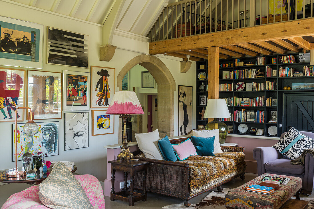 Living room with loft view, artwork and patterned upholstered furniture