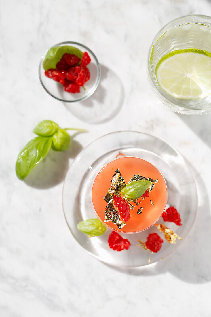 Iced flower raspberry and basil jelly with gold leaves