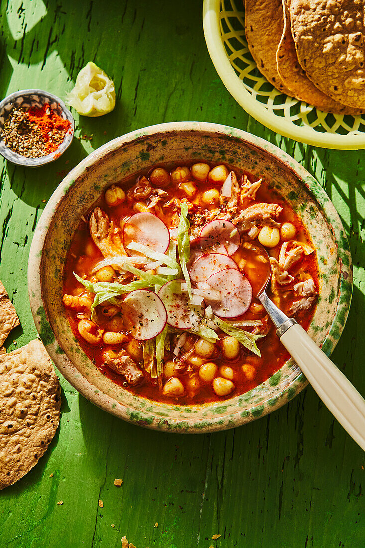Pozole - traditional corn soup from Mexico with pork ribs