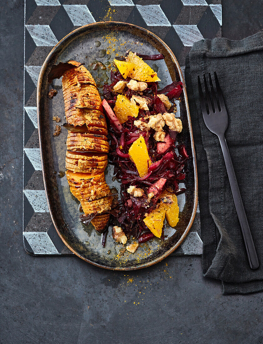 Fanned sweet potato with lukewarm red cabbage and orange salad