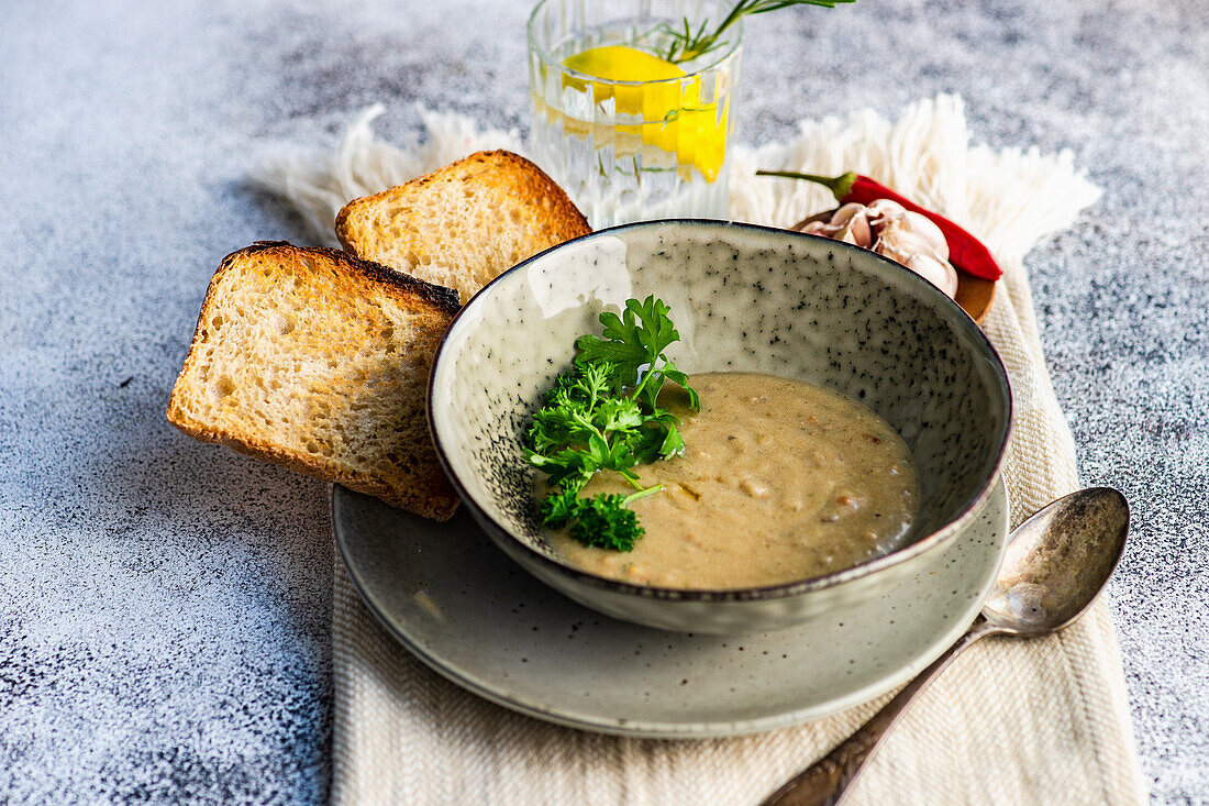 Healthy vegetarian soup made of mushrooms served in a bowl