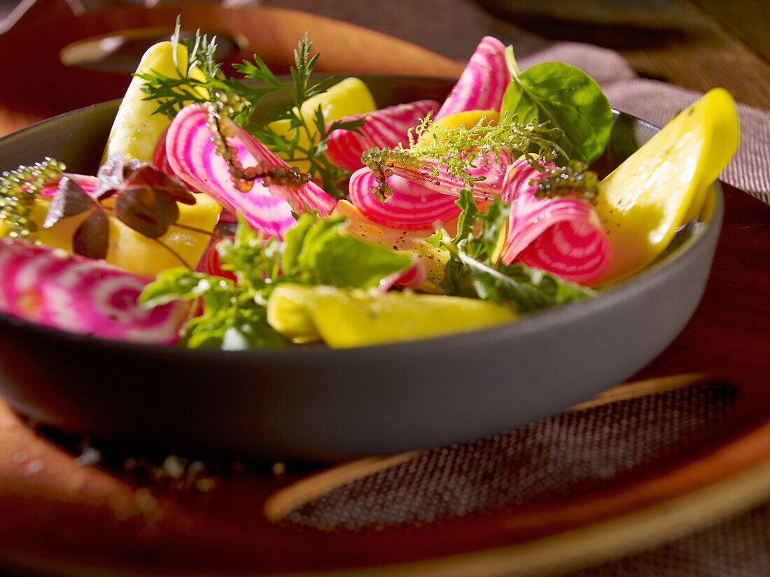 Chioggia beet carpaccio with wild herb salad and Japanese sea grapes