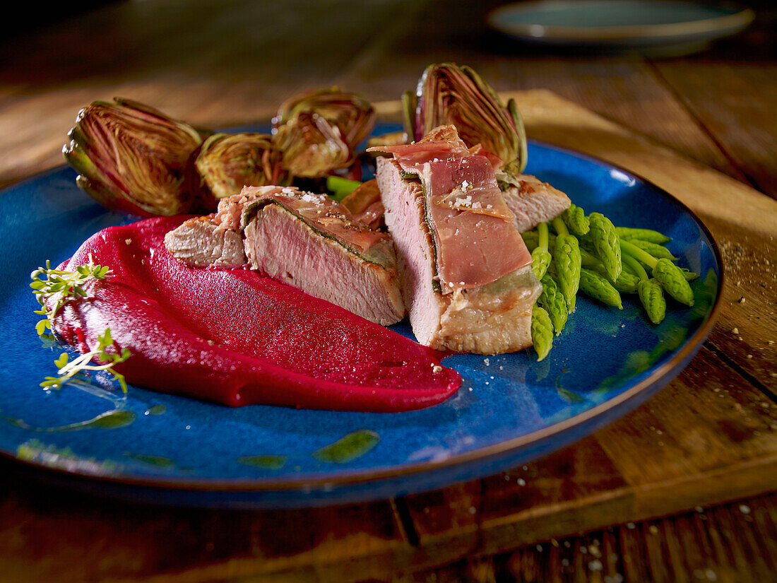 Veal saltimbocca with wild asparagus and beet puree