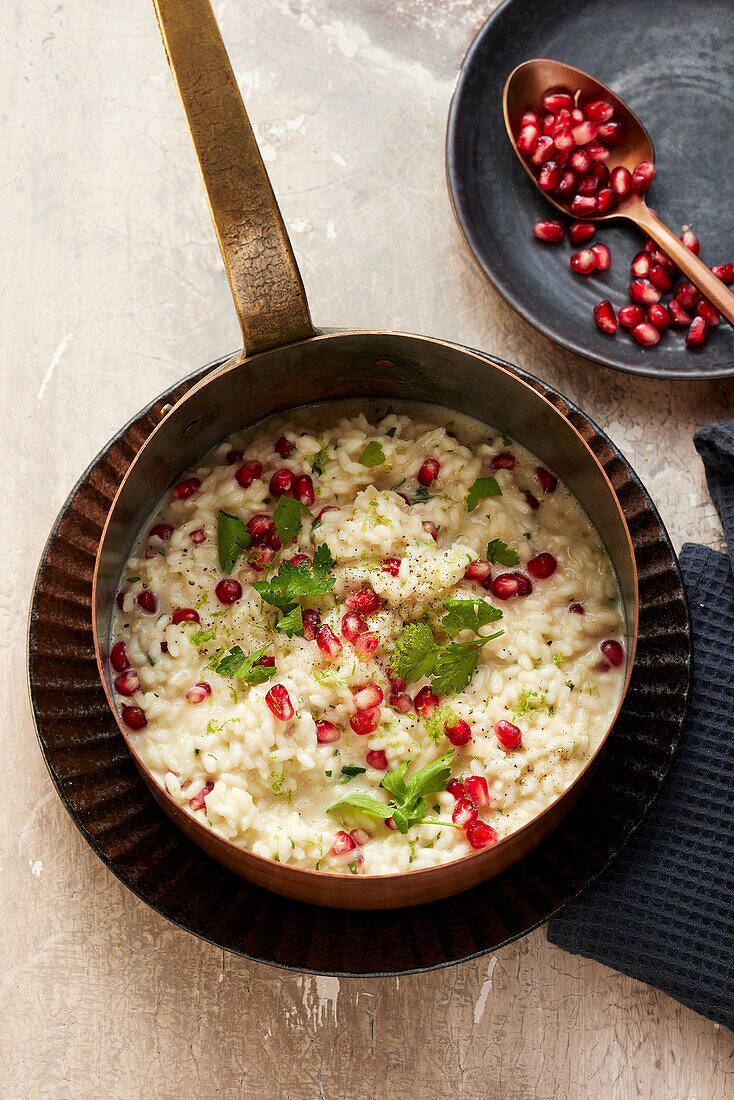 Risotto with cream and pomegranate seeds