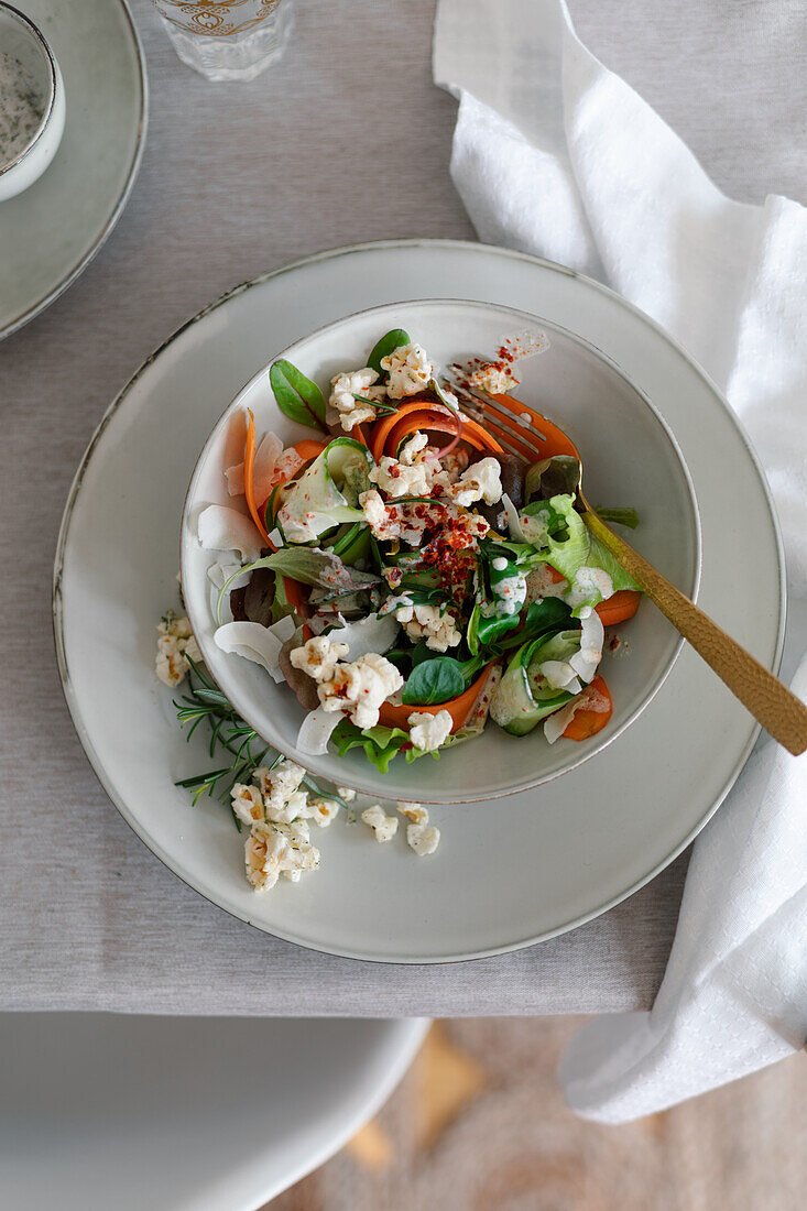 Salad with salted rosemary popcorn