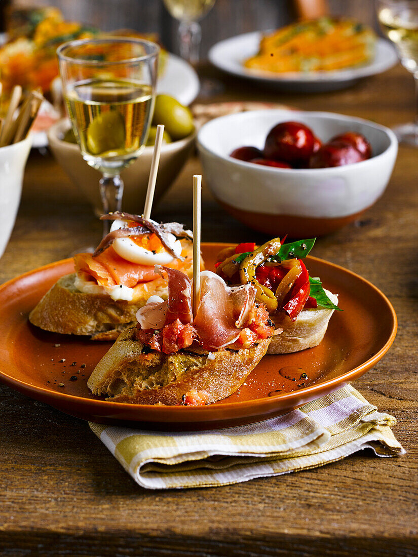 Spanish ham with crusty bread and chopped tomato