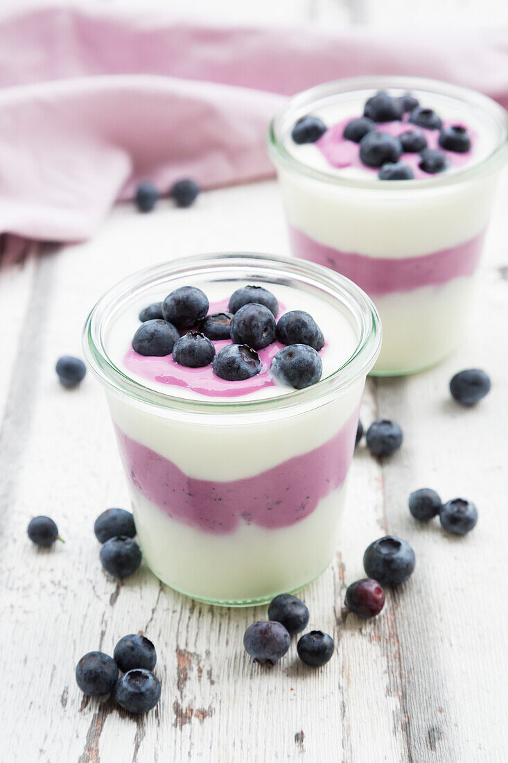 Glass of Greek yogurt with blueberries